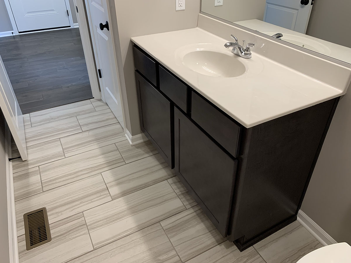 The Firethorn bathroom sink and tile floor