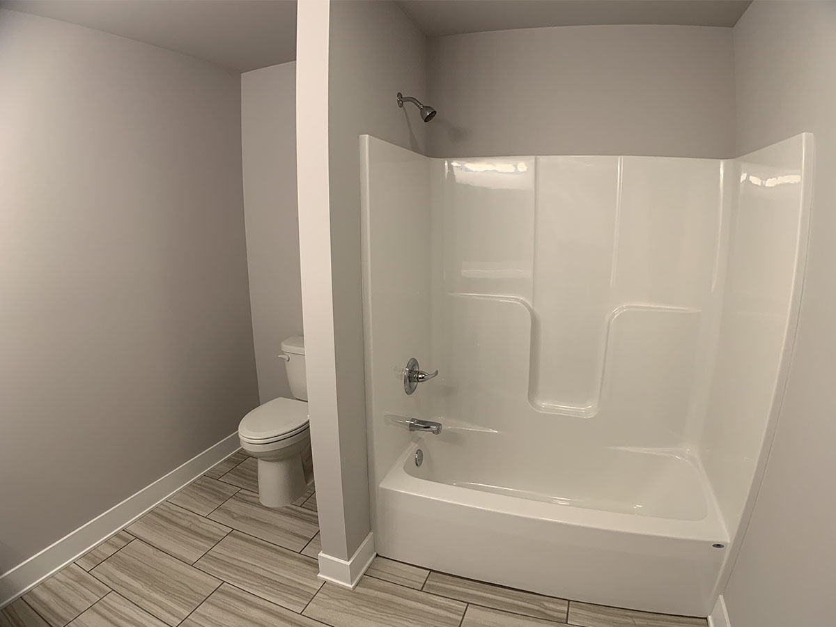 Master bathroom with shower and toilet