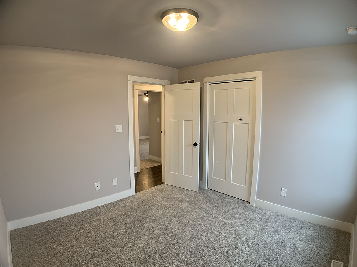 Third bedroom with window and closet