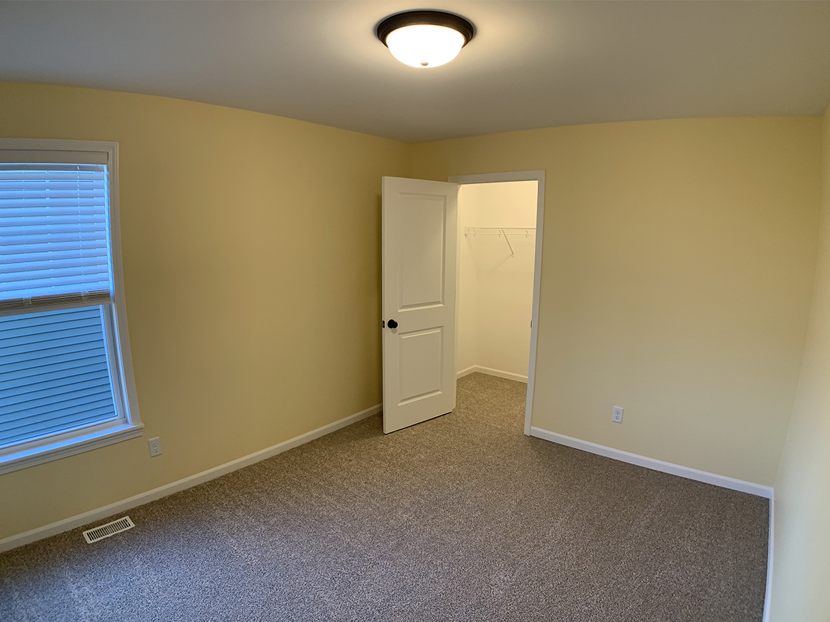 Third bedroom with window and closet