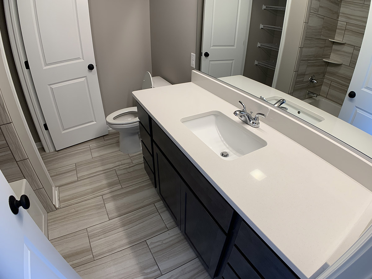 Master bathroom with large sink and tile floor