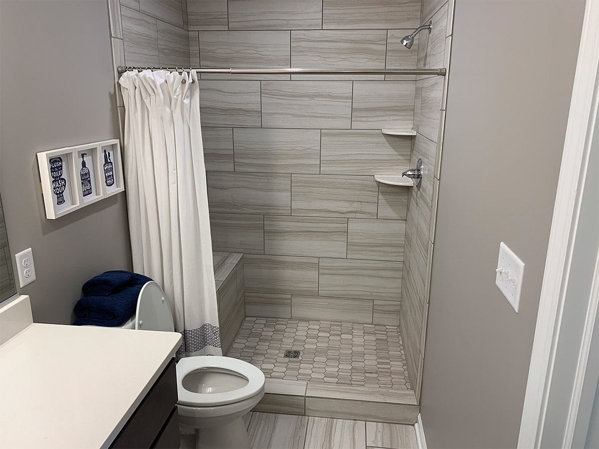 Master bathroom with tile floor and shower