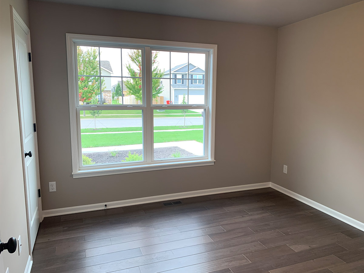 Bedroom with double hung windows