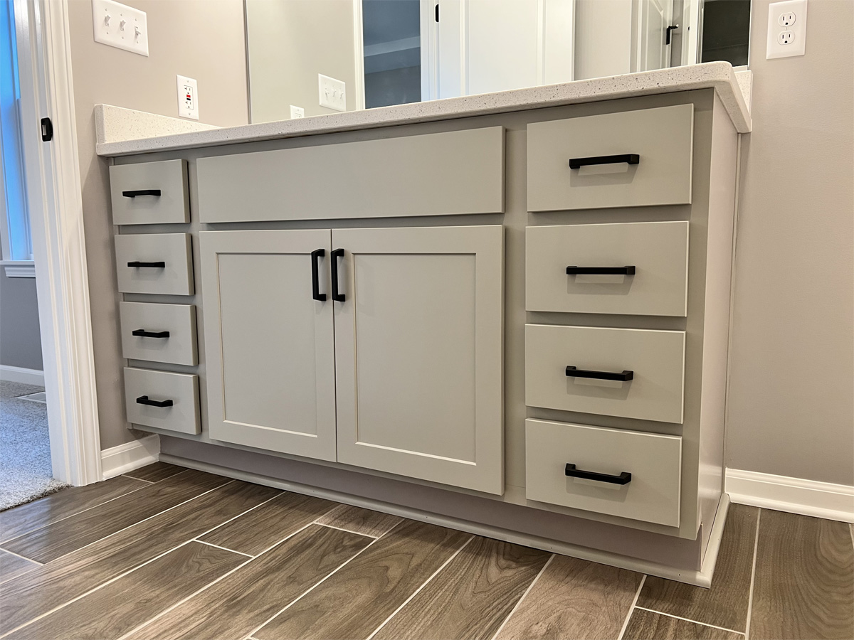 The Jefferson master bathroom vanity with door knobs and draw pulls