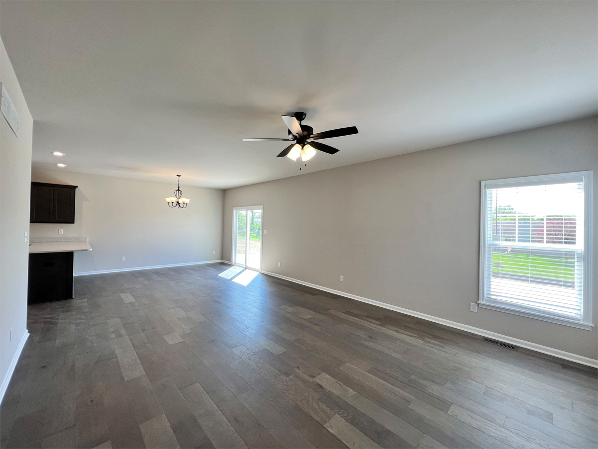 The Middleton dining room with hardwood floors and ceiling fan