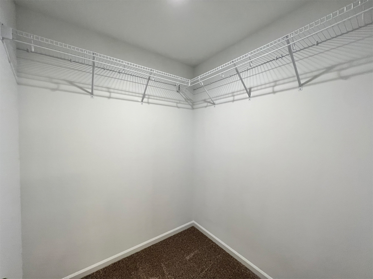 The Redbud master bedroom closet with wire shelving