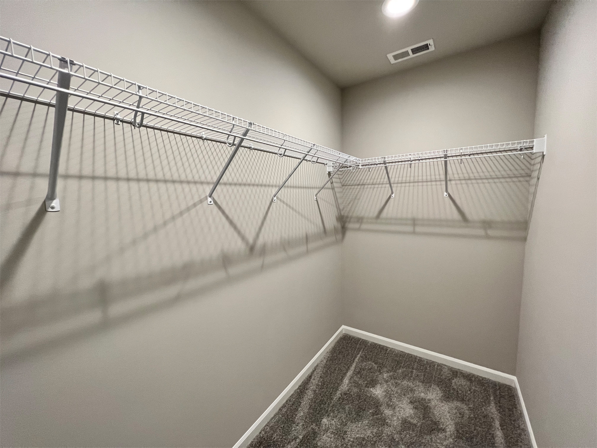 The Washington third bedroom walk in closet with wire shevling