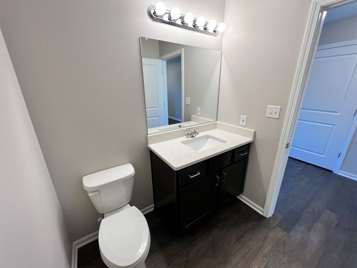 The Sherman powder room with vanity and toilet