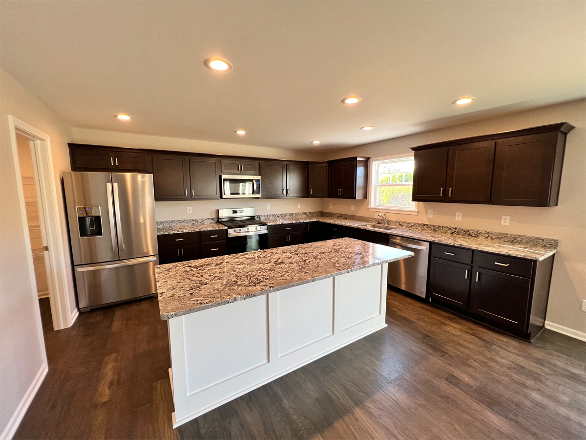The Sherman kitchen with hardwood floors, cabinets and appliances