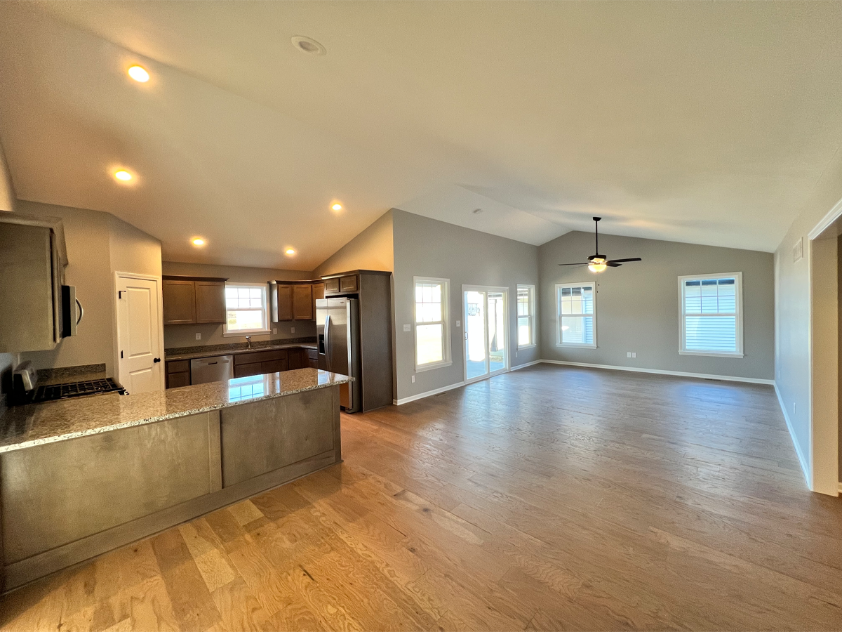 Juniper kitchen and dining room with hardwood floors, granite countertops and maple cabinets