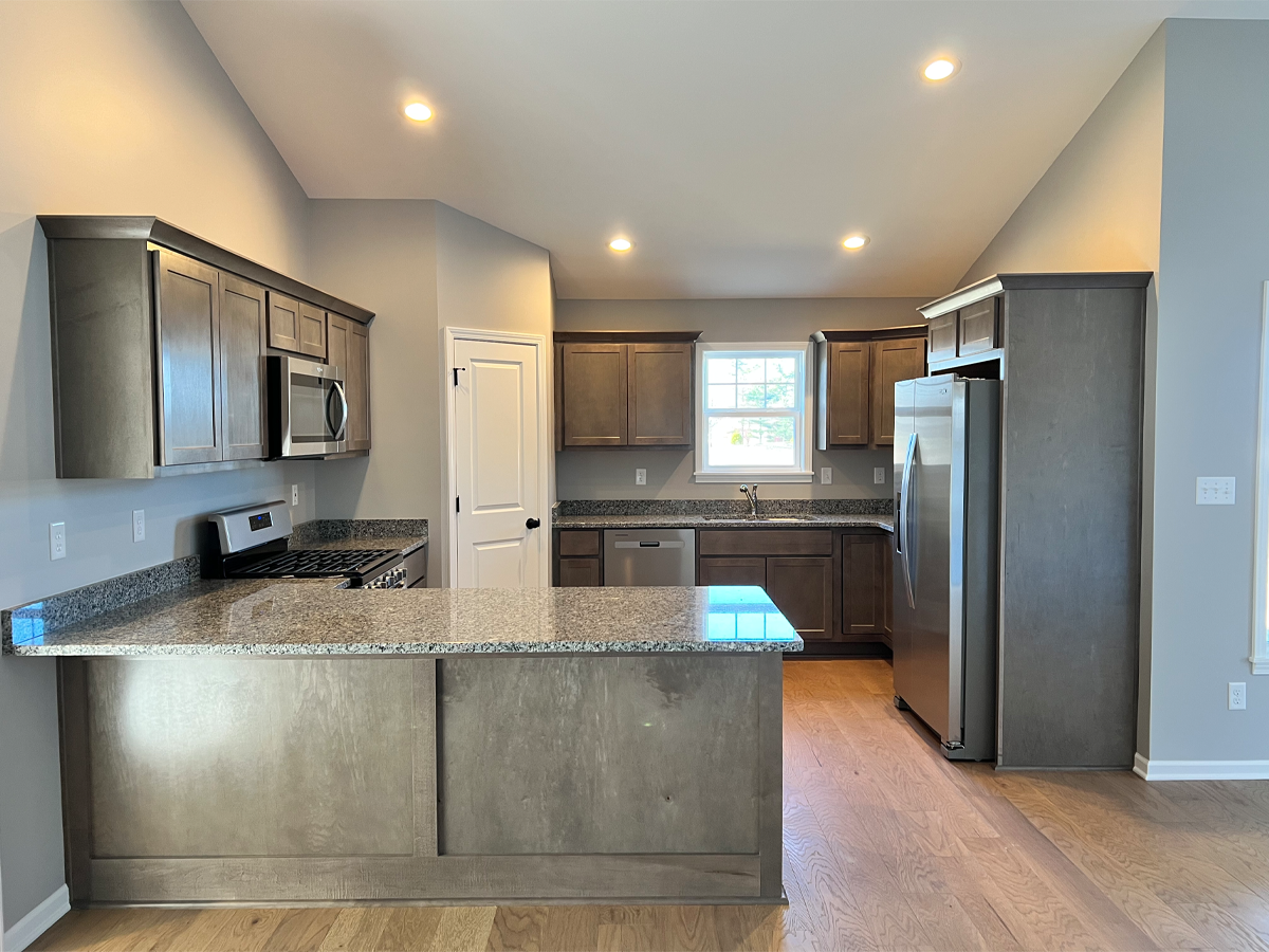Juniper kitchen with granite countertops, appliances and hardwood floors