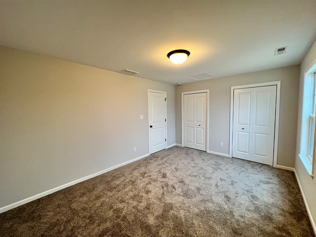 The Walton third bedroom with carpet and closets